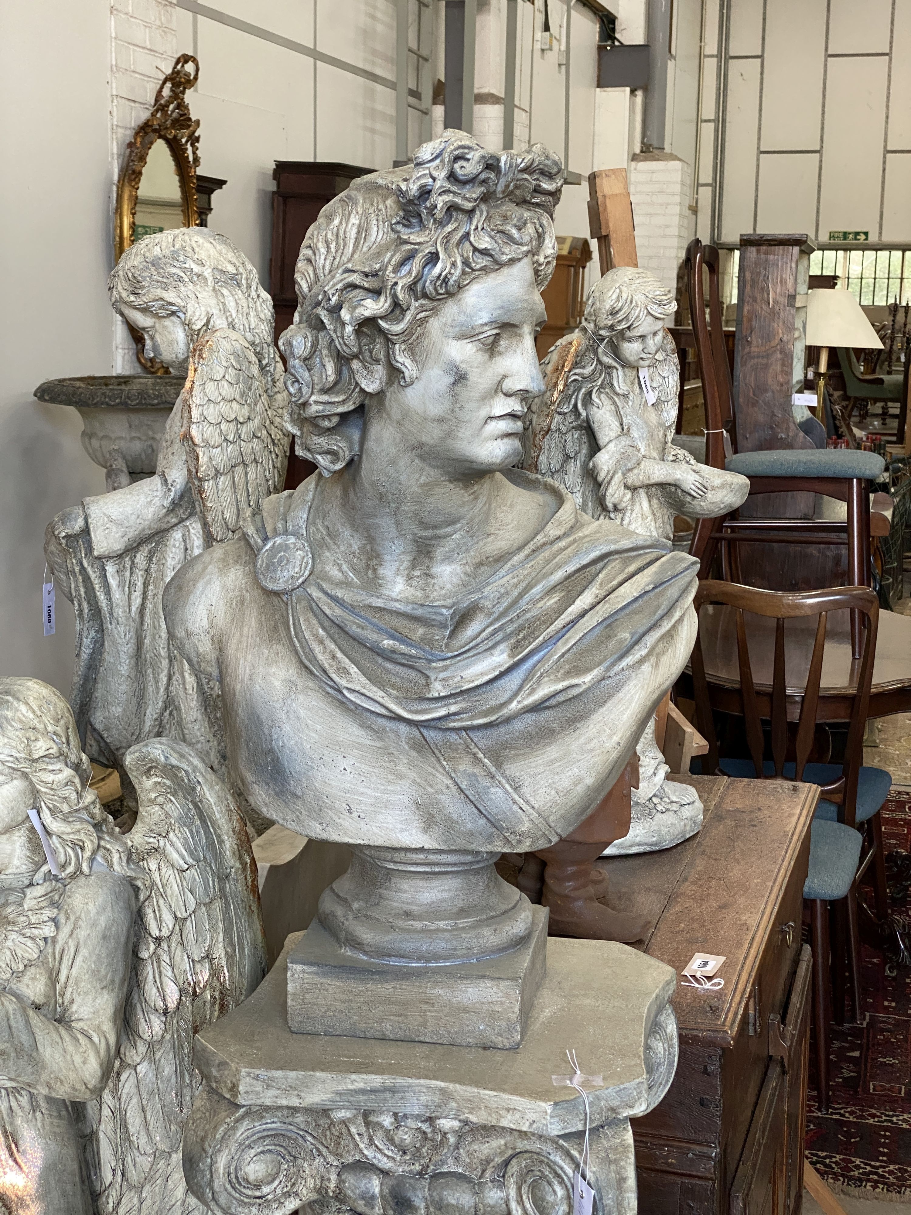 A fibre clay classical bust on ionic fluted column, height 170cm
